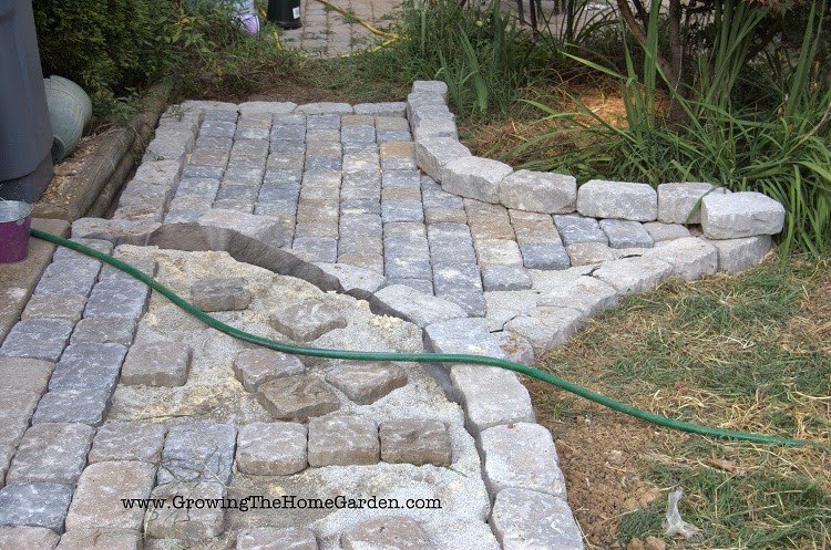 Using paving stones to build a pathway, patio, or sidewalk.