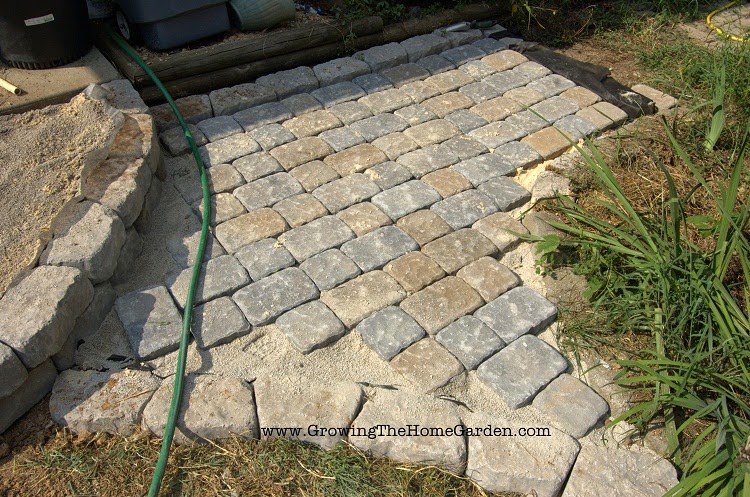 Using paving stones to build a pathway, patio, or sidewalk.